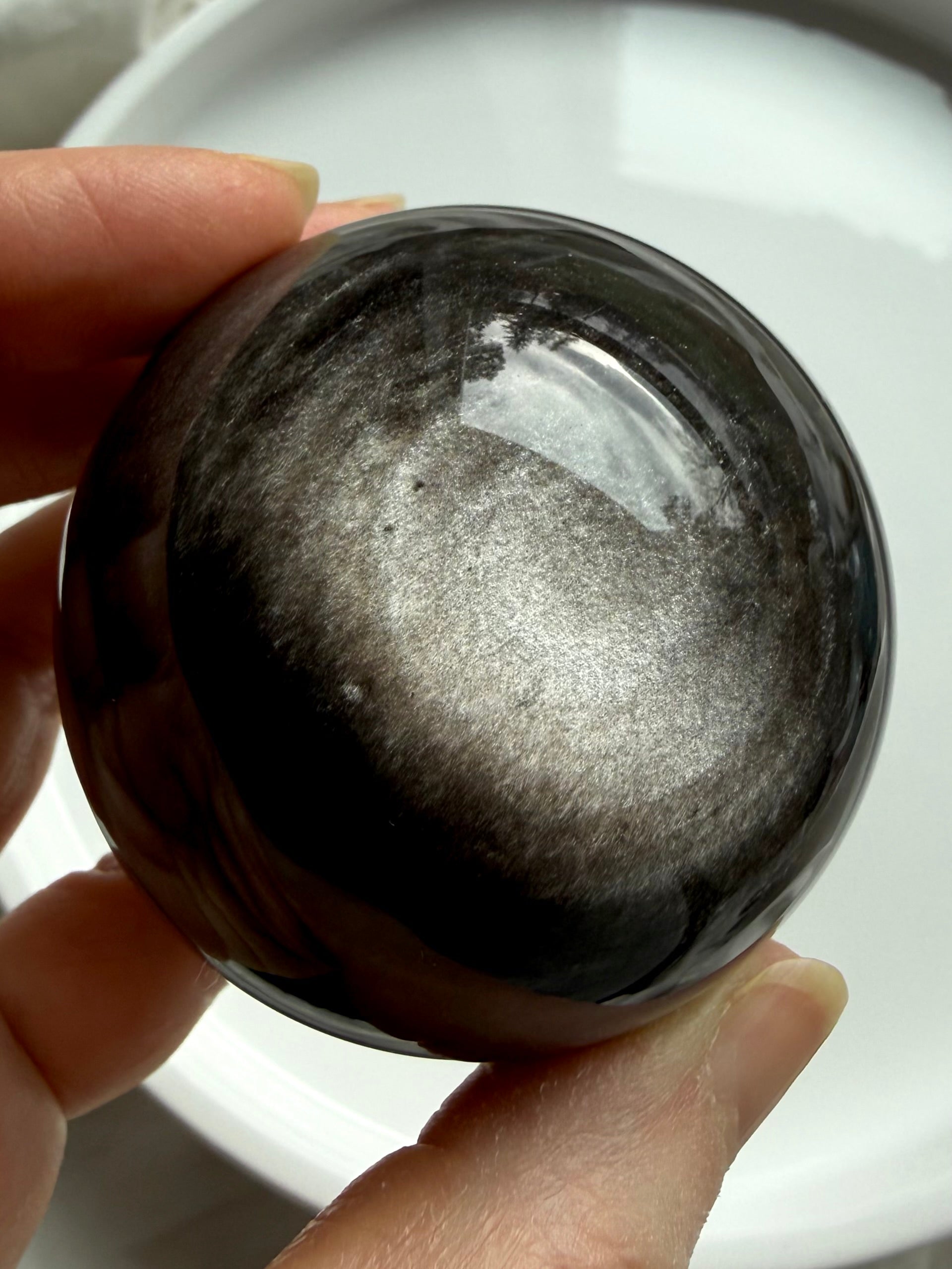 Silver Sheen Obsidian sphere crystal ball with luminous silver flash for protection, grounding, and intuitive clarity