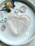 rose quartz heart bowl styled with crystal accents and dried botanical décor, heart chakra gemstone dish for healing, love, and sacred space decor