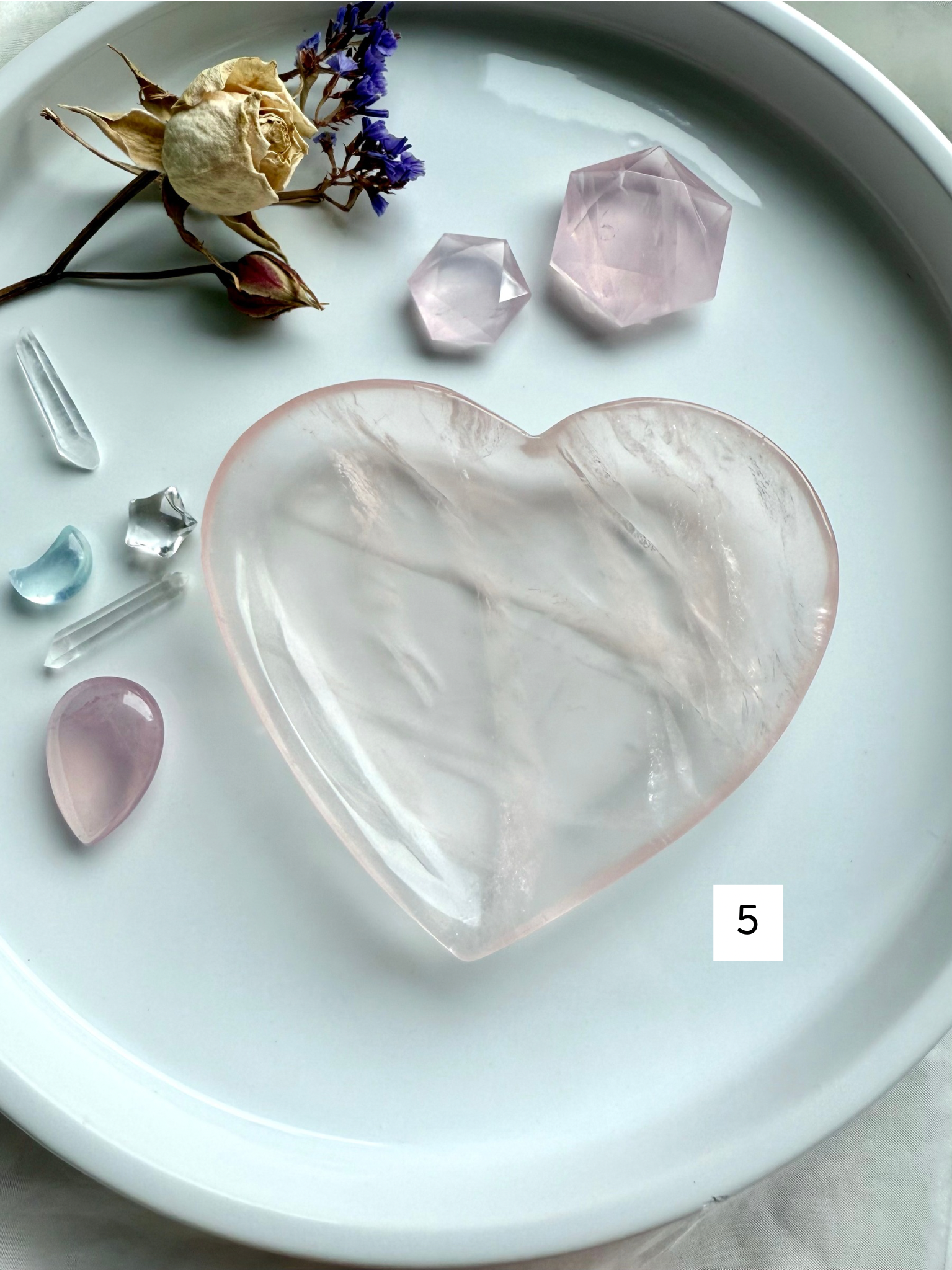 rose quartz heart bowl styled with crystal accents and dried botanical décor, heart chakra gemstone dish for healing, love, and sacred space decor