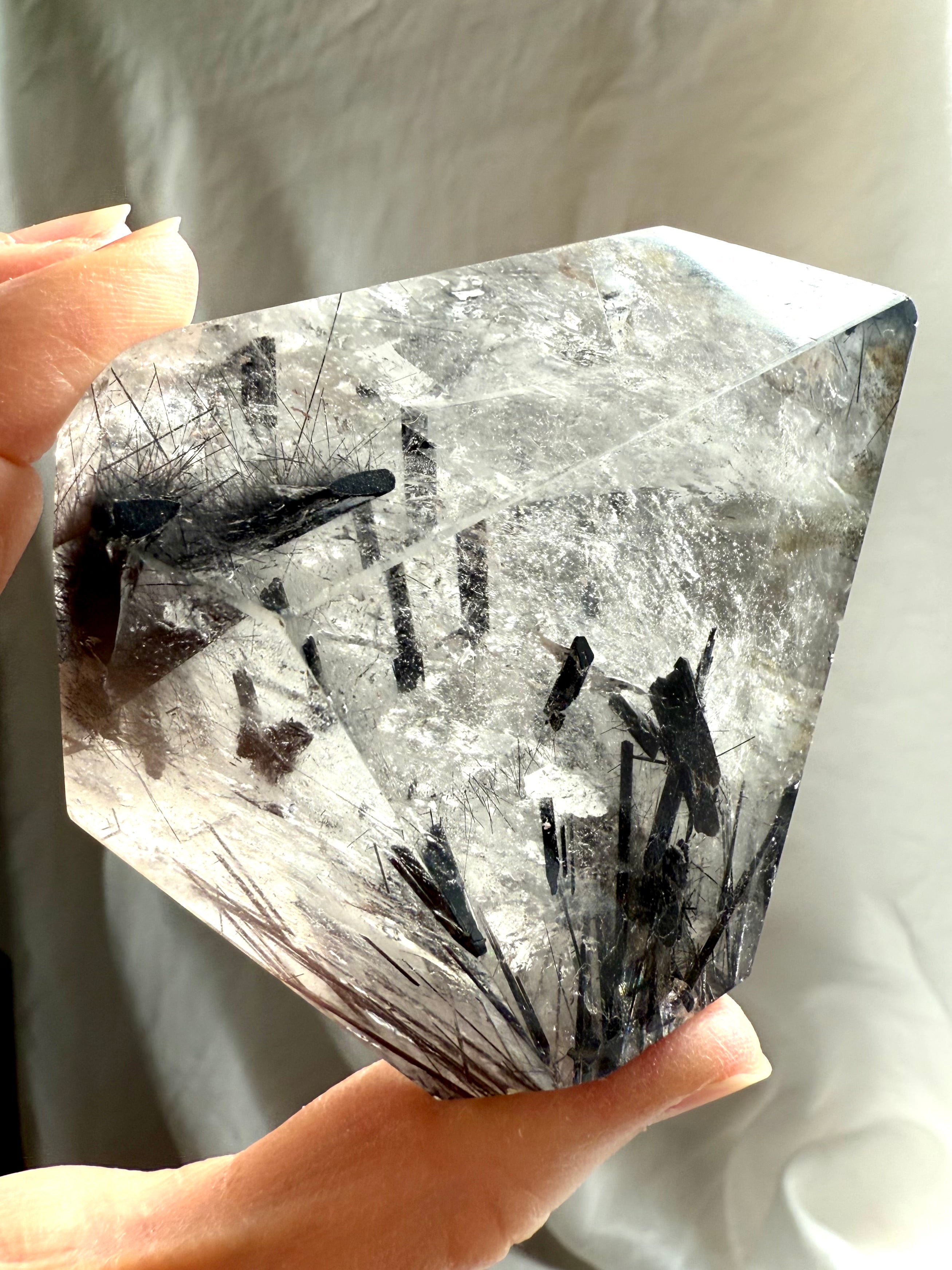 Large Black Tourmaline in Quartz freeform crystal for protection and energetic grounding, held in hand
