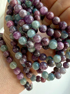 multiple Ruby Sapphire gemstone bracelets showing vibrant gemstone colors & natural ruby chatoyance