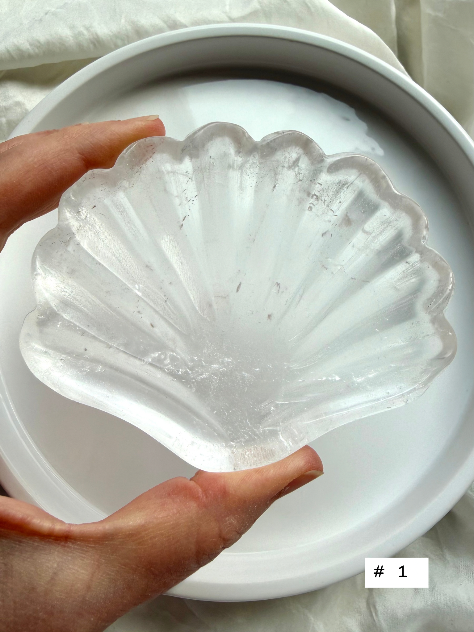 Clear Quartz shell bowl, individual piece #1, showing natural crystal patterns and polished scallop carving.
