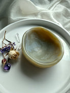 Beige Agate hand-carved gemstone bowl on display – grounding crystal décor for peace and balance