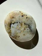 One-of-a-kind Dendritic Agate freeform in a flatlay, highlighting creamy white tones and natural landscape inclusions