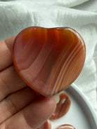 Carnelian heart shaped crystal worry stone thumb stone for Root and Sacral Chakra healing