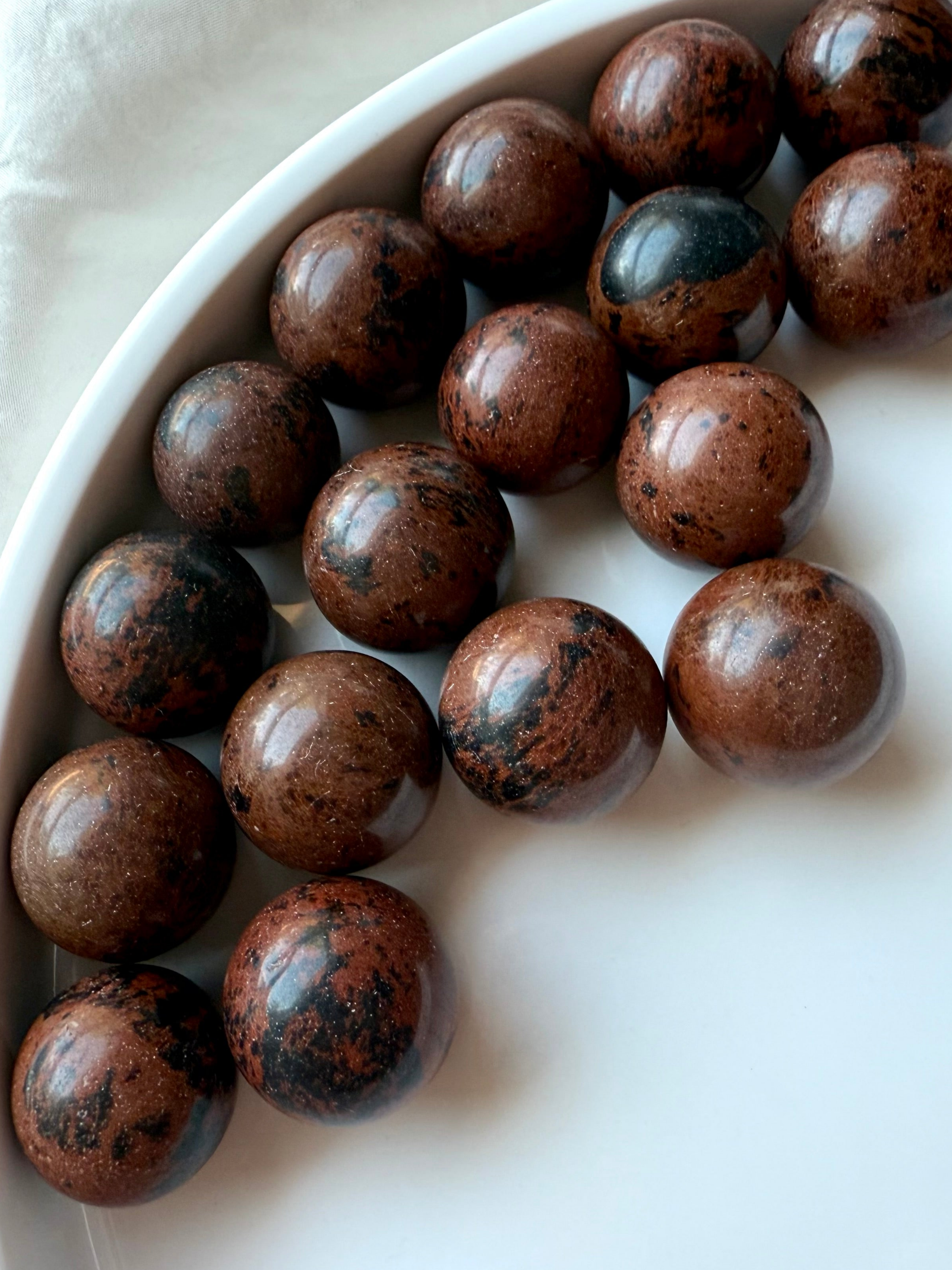Mahogany Obsidian mini spheres with brown and black patterns – root and sacral chakra crystals for protection and strength