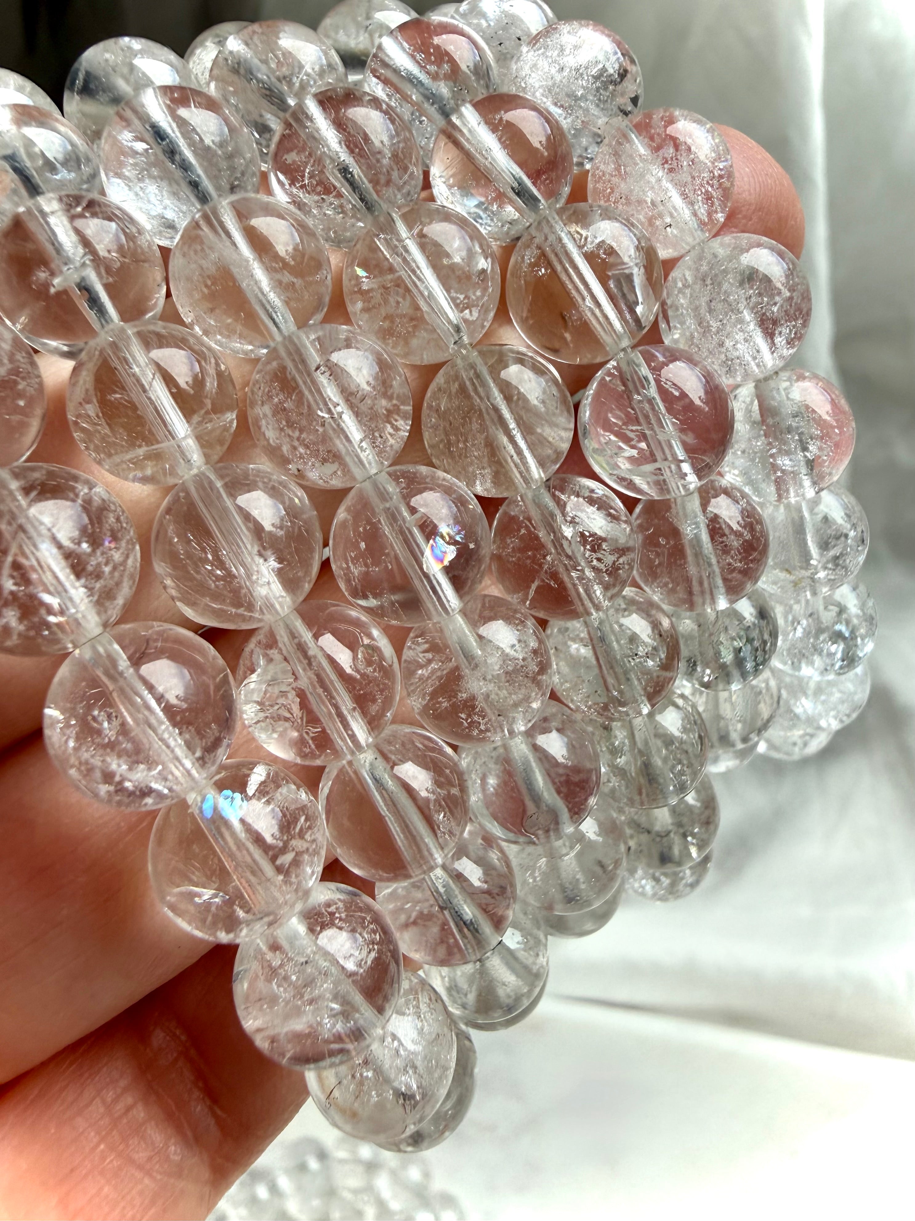 Clear Quartz bead bracelet with soft rainbow flashes for chakra healing and energetic cleansing