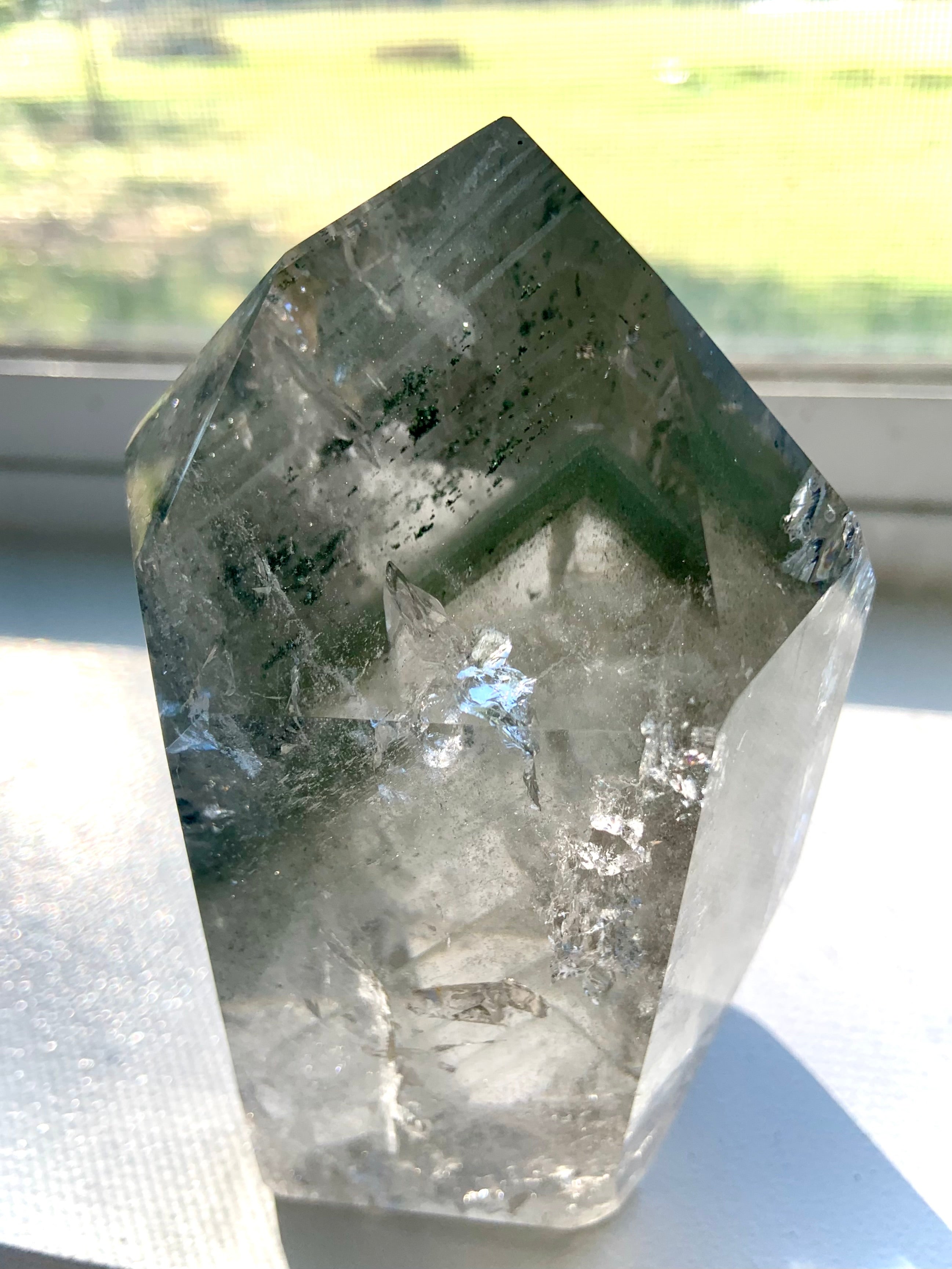 A Garden Quartz Lodolite Crystal with chlorite phantoms, mossy mineral inclusions + tons of rainbows