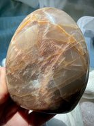 Peach Moonstone with Sunstone inclusions showing glittery golden shimmer, peach orange color and natural mineral patterns