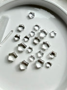 Mini Clear Quartz star carvings featuring sparkling transparent crystals, tiny five-point stars for clarity, manifestation and crystal grids