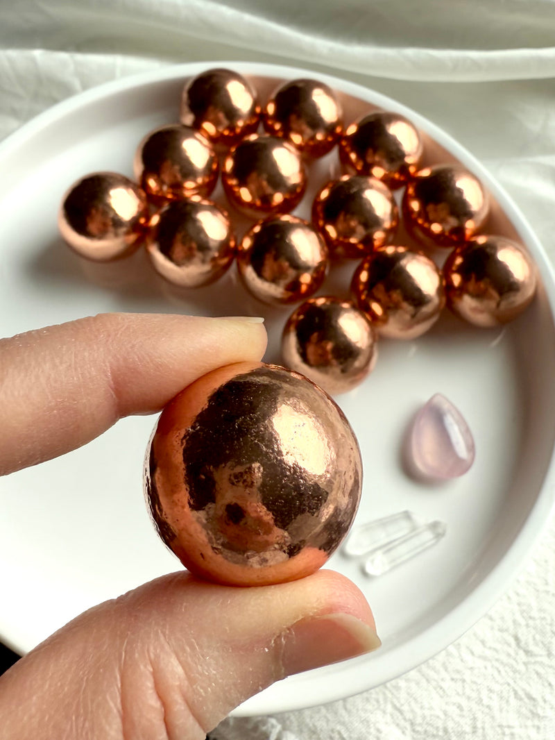 30 mm Michigan copper spheres shown on between my fingertips for scale