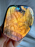 Orange Flash Labradorite freeform with vivid coppery orange full-face labradorescence and purple accents