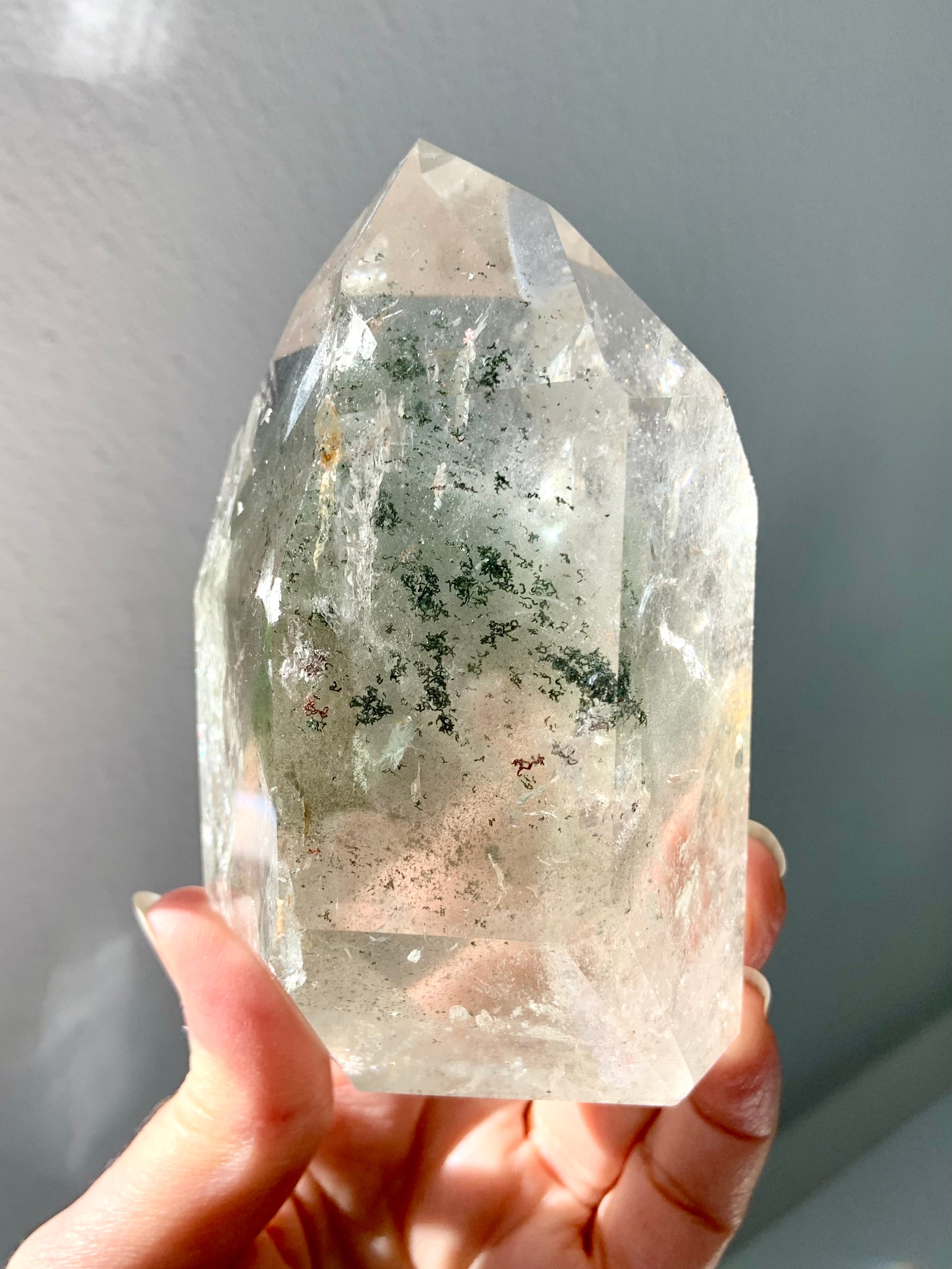 This Garden Quartz Specimen held to the light showing chlorite phantoms & mossy mineral inclusions