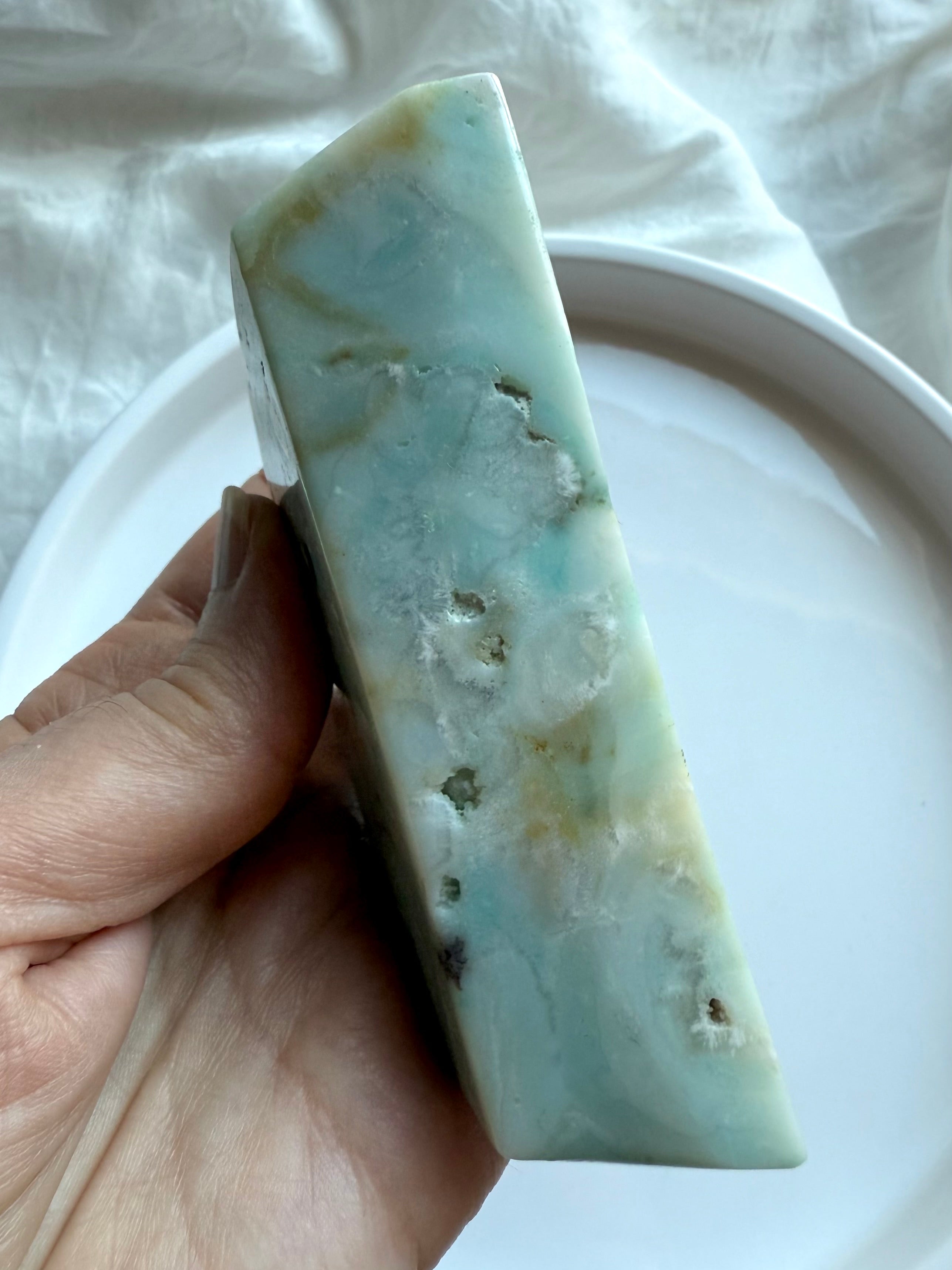 Sky Blue Quartz crescent moon bowl side view held in hand