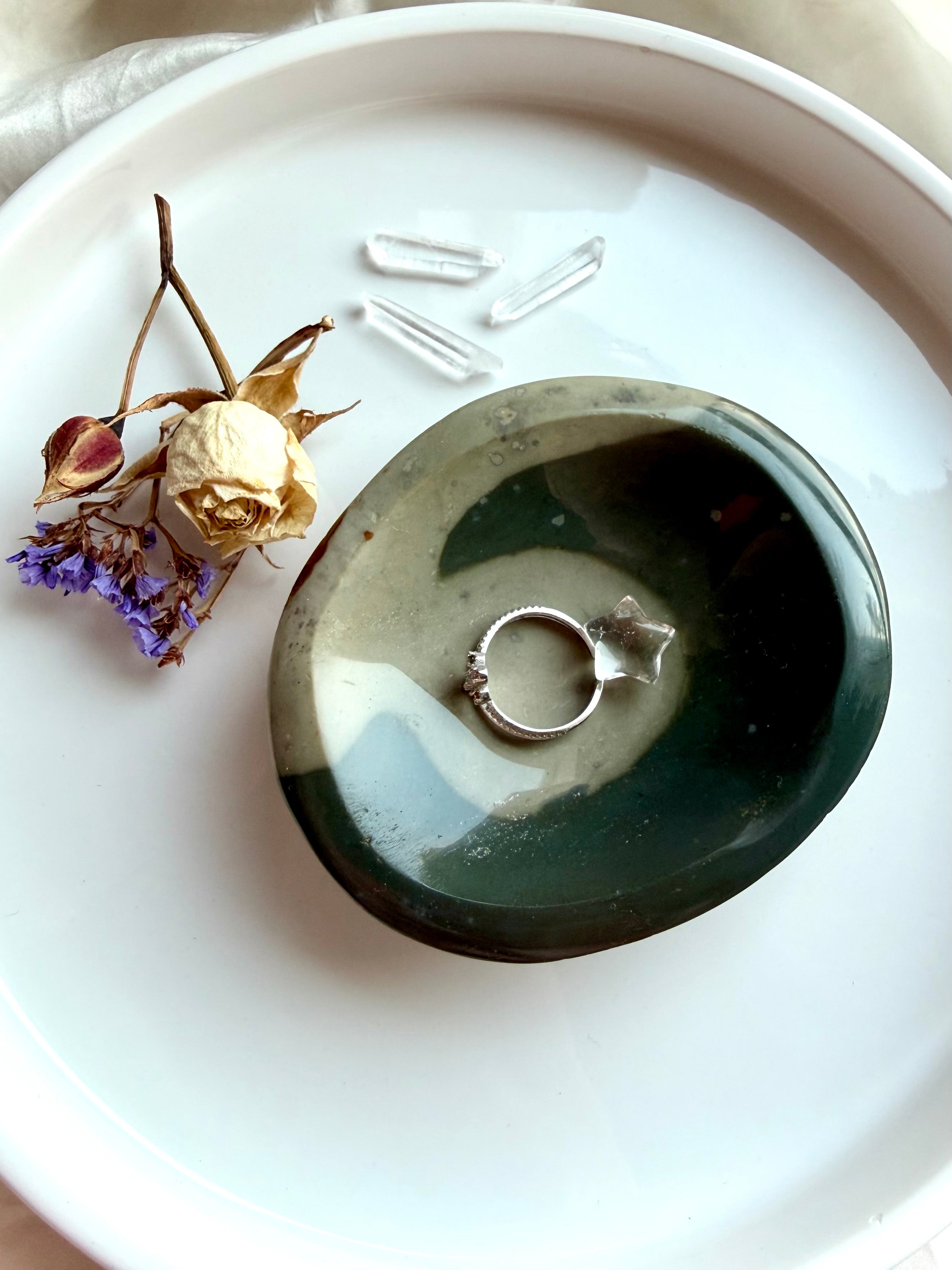polychrome jasper crystal bowl styled with jewelry on tray with selenite and palo santo