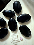 Intuitively chosen Black Obsidian palm stones with smooth oval shape for meditation, pocket stones, and energy work