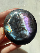 Polished Labradorite palm stone with vivid blue, violet and silvery flash, a one-of-a-kind Madagascar crystal