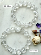 Stretchy Rainbow Quartz bracelet beside dried flowers showing bead size comparison 