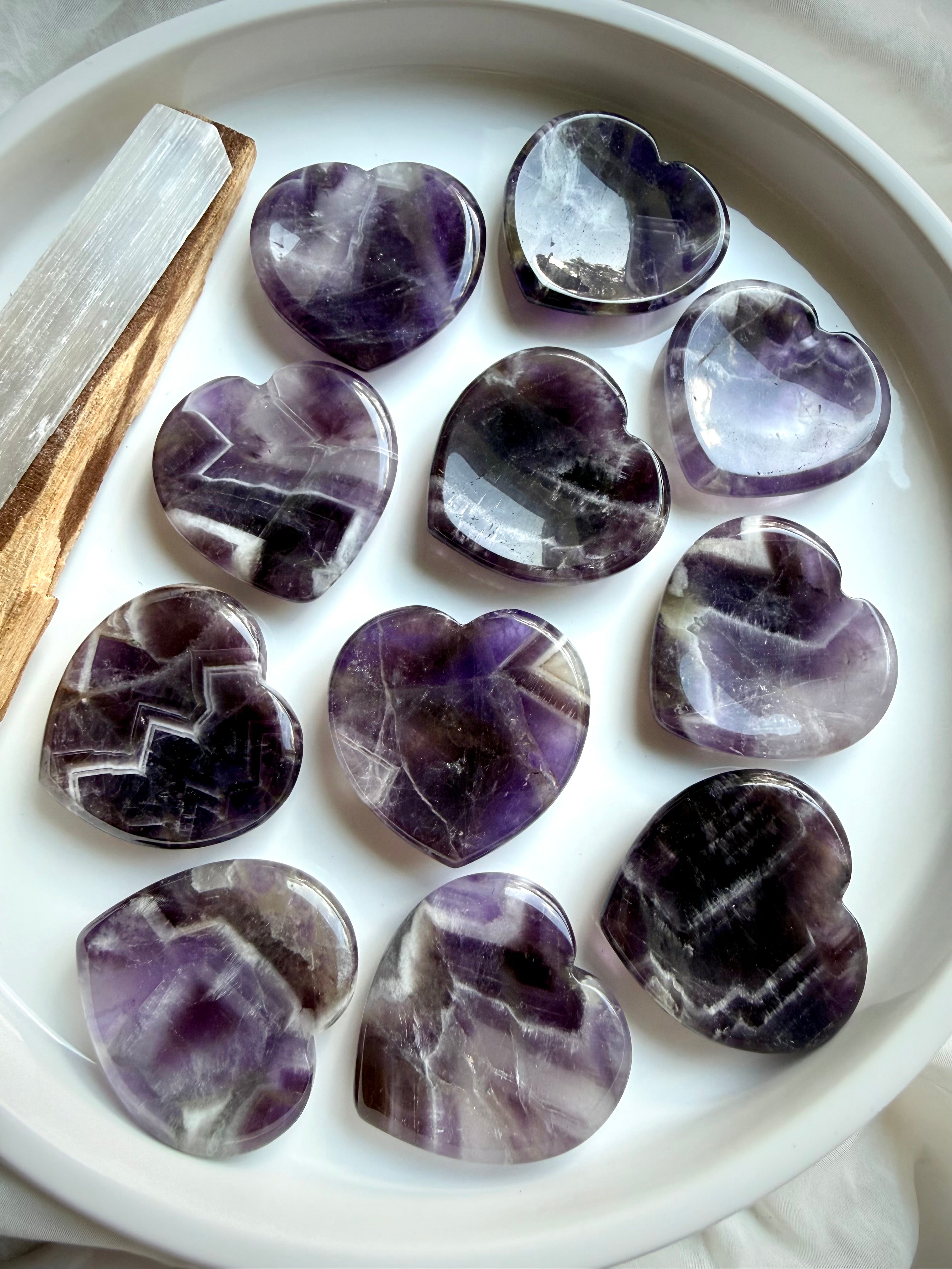 dream amethyst heart worry stones displayed on dish for meditation calm and spiritual awareness
