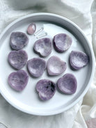 Natural Lepidolite heart worry stones with varied lilac purple, white and gray marbling