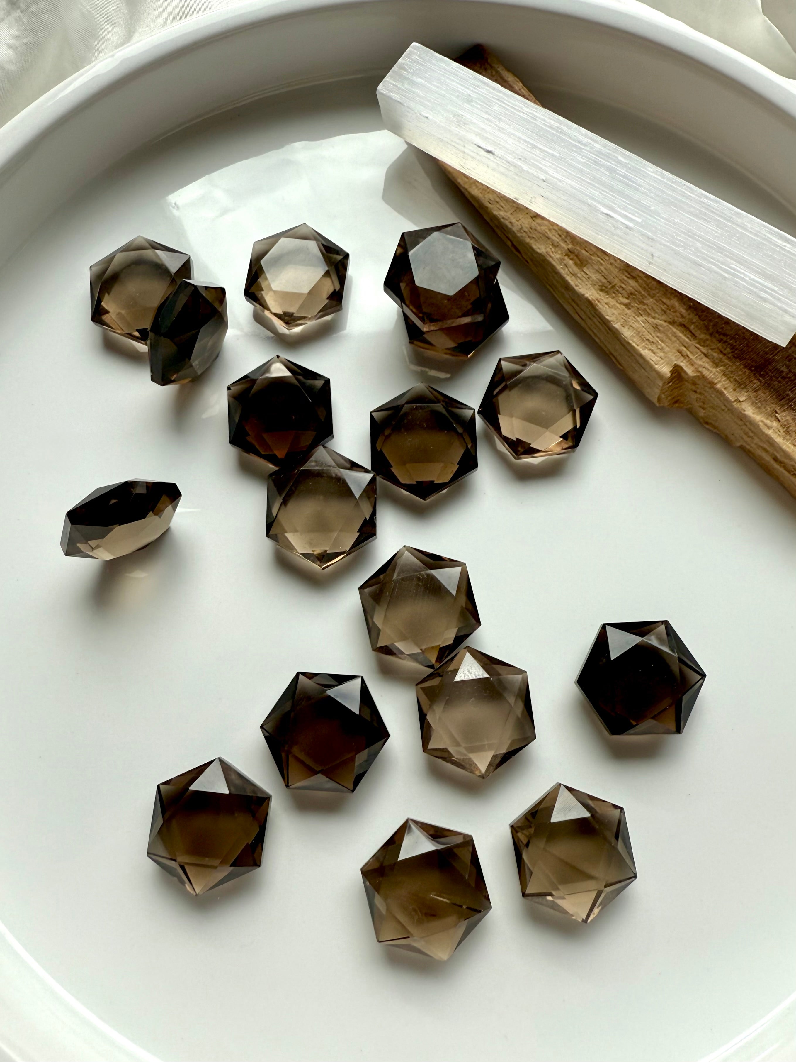 Mini crystal hexagons made from clear Smoky Quartz with sacred geometric cut and earthy hues