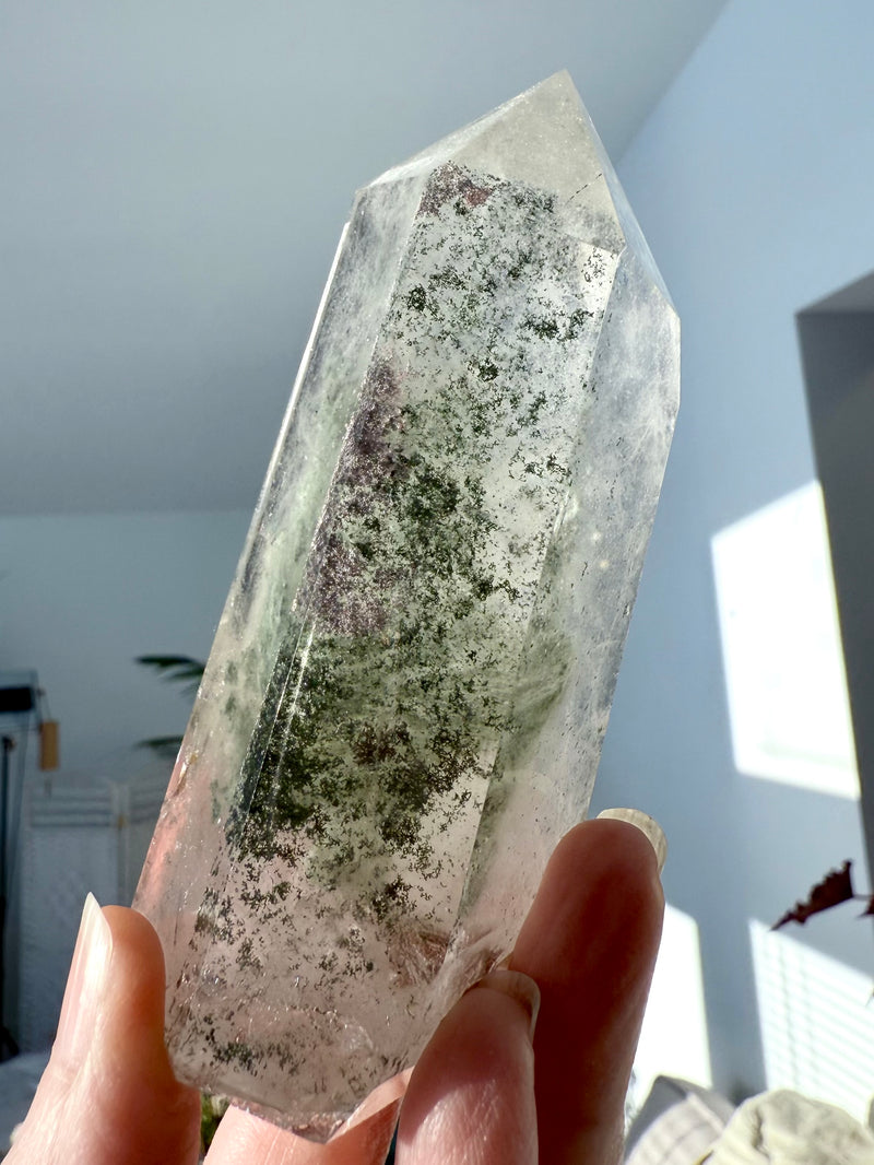 A Garden Quartz Crystal Tower with a stack of Chlorite Phantoms offering Earth wisdom from Mama Gaia