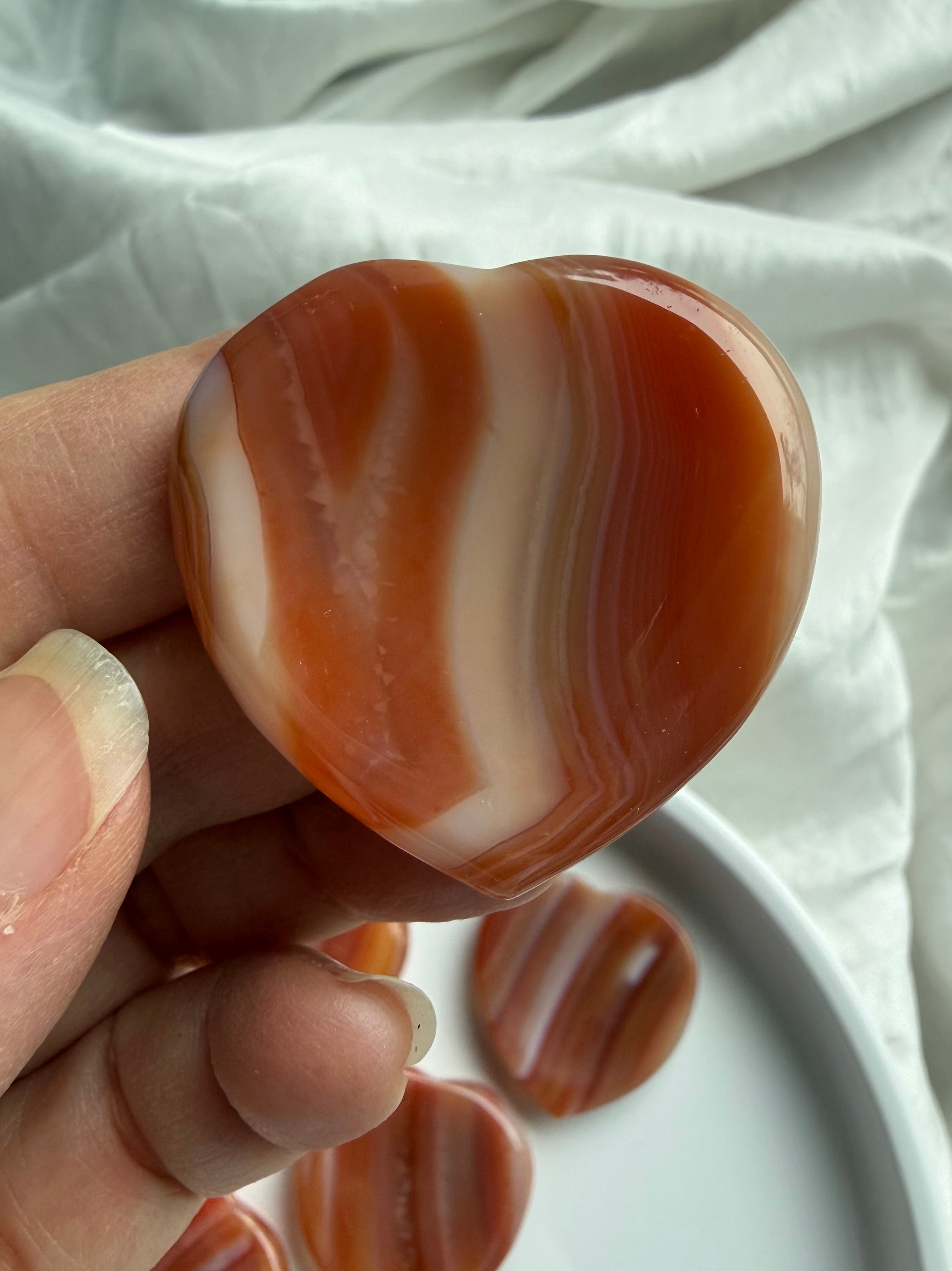 Carnelian crystal heart worry stone pocket stone for grounding and emotional balance