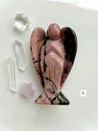 Polished Rhodonite angel crystal with rich rose tones for comfort and self-love