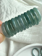 Stacked rounded jadeite band rings showing thickness and polish of Blue Water jade