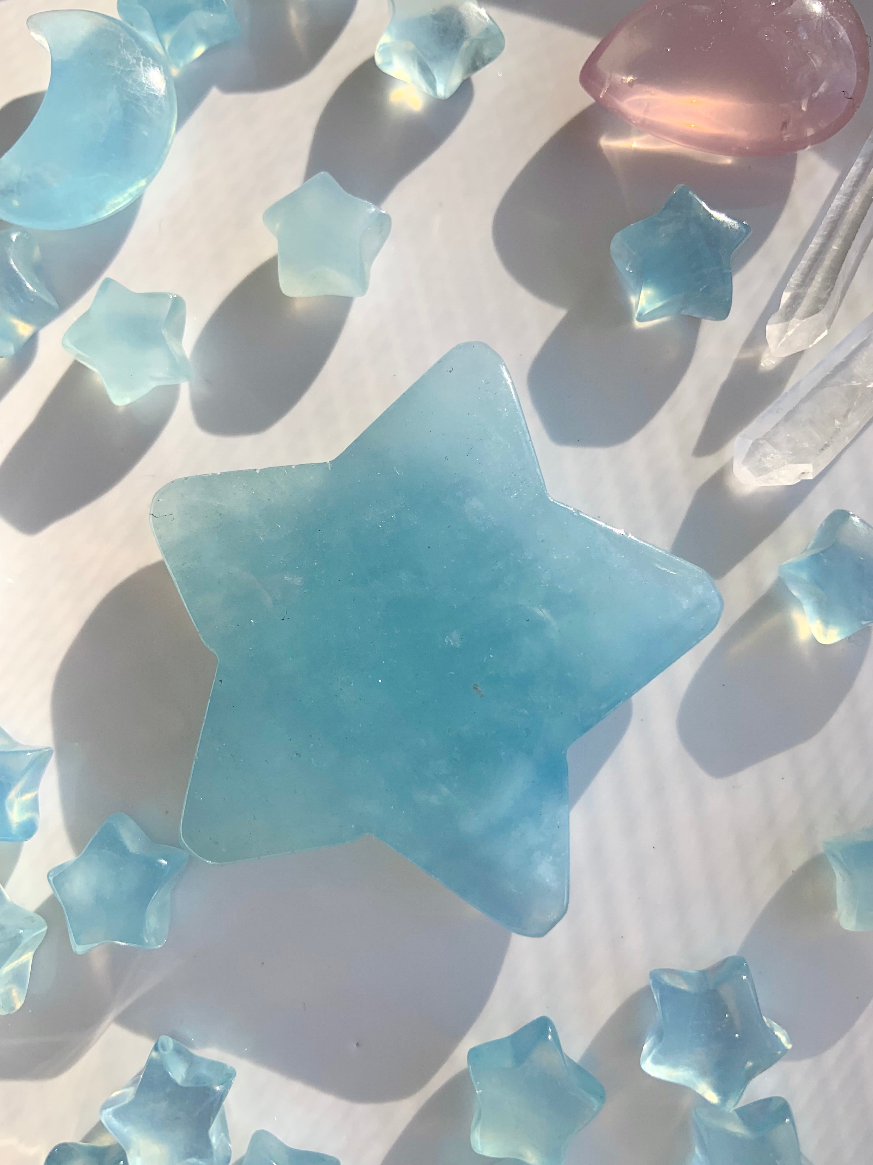 Larger Aquamarine star surrounded by smaller crystals with calming ocean tones