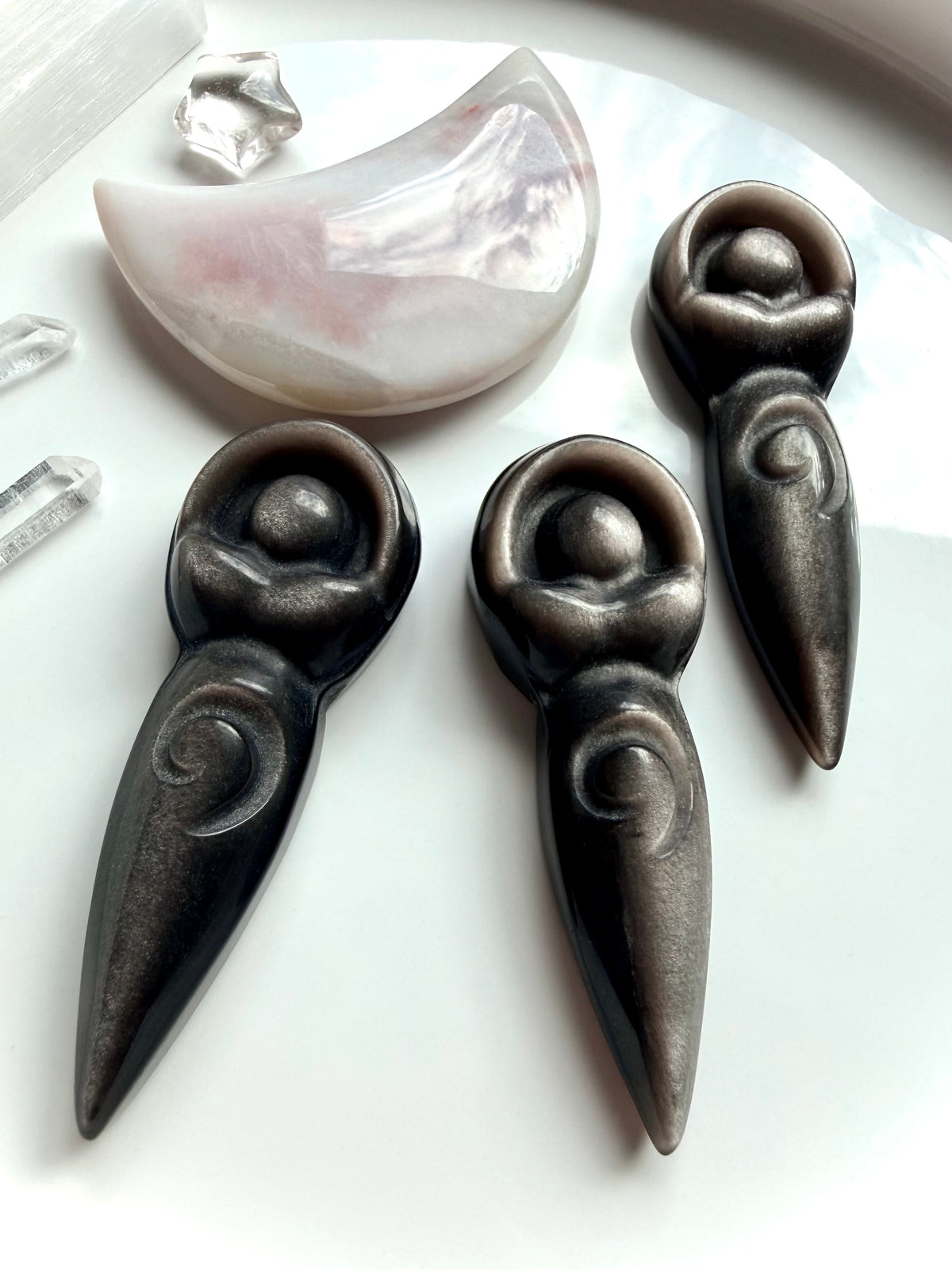 Silver Sheen Obsidian spiral goddess carvings with luminous silver shimmer and detailed Spiral of Life design