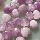 Close-up detail showing shimmer & color variations in Pink Kunzite mini hearts — radiant crystals for love & heart-centered energy.