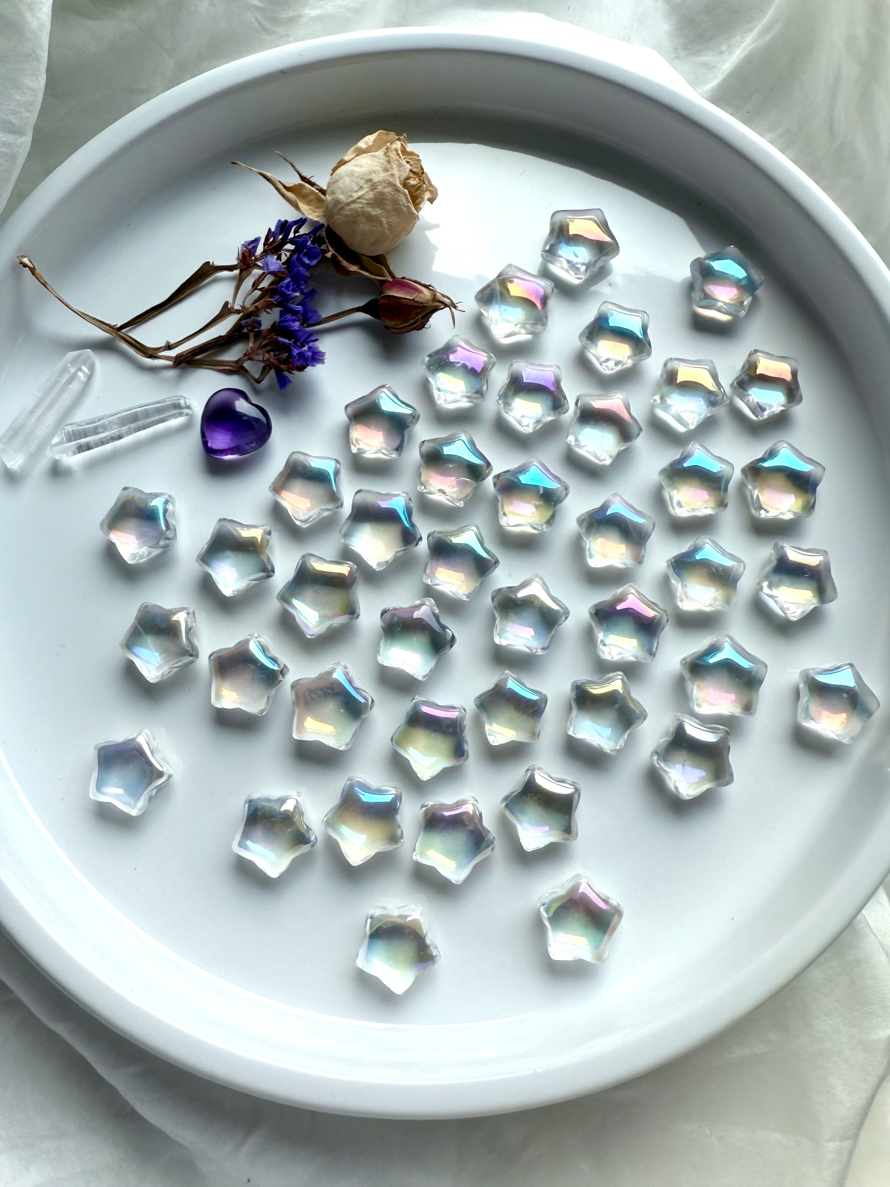 Mini Aura Quartz crystal stars with iridescent rainbow sheen, polished star carvings for healing, altar décor, crystal grids, and universal chakra energy.