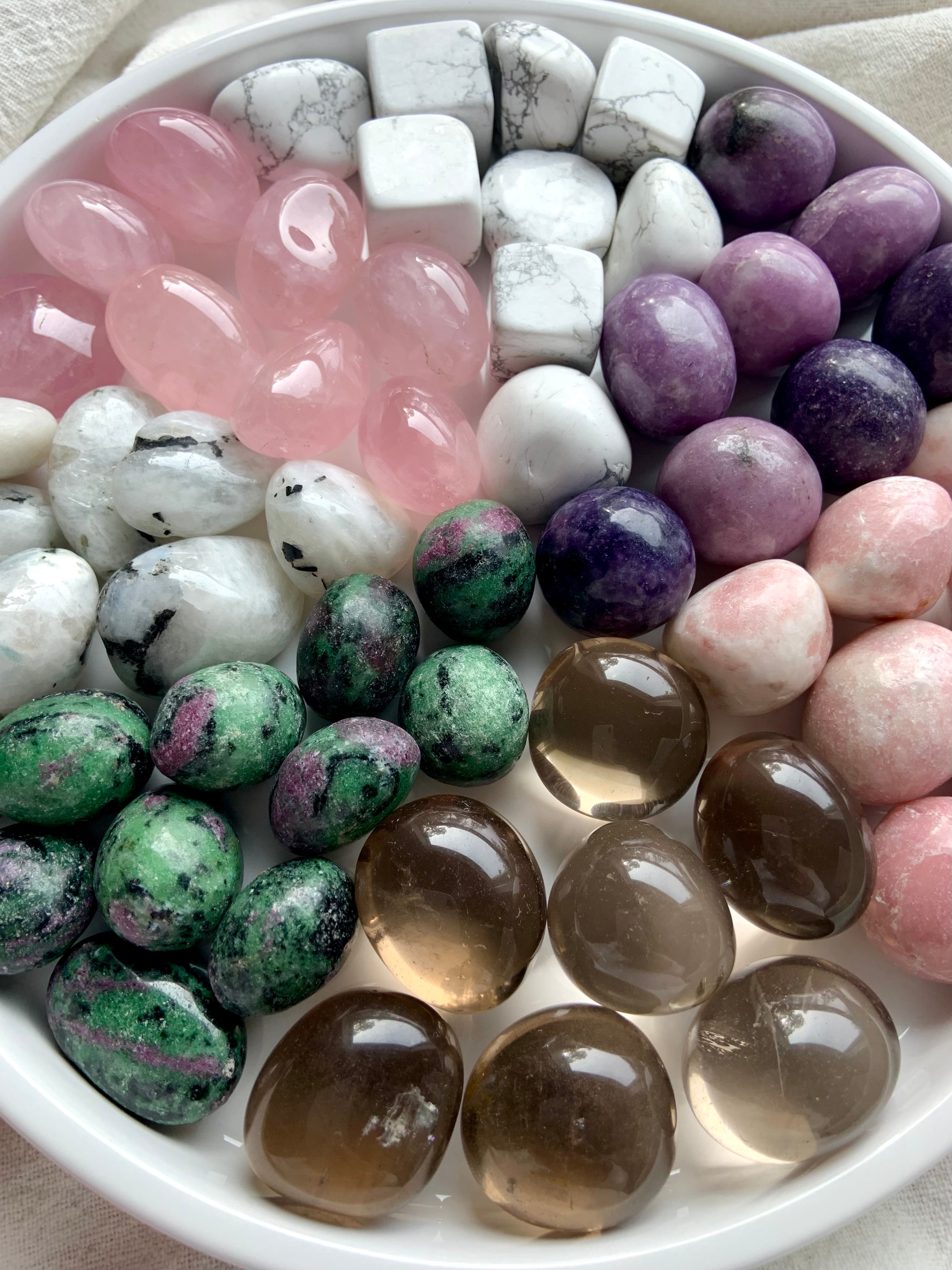 Healing crystals for grief & emotional support: rose quartz, howlite, lepidolite, moonstone, pink opal, smoky quartz, & ruby zoisite