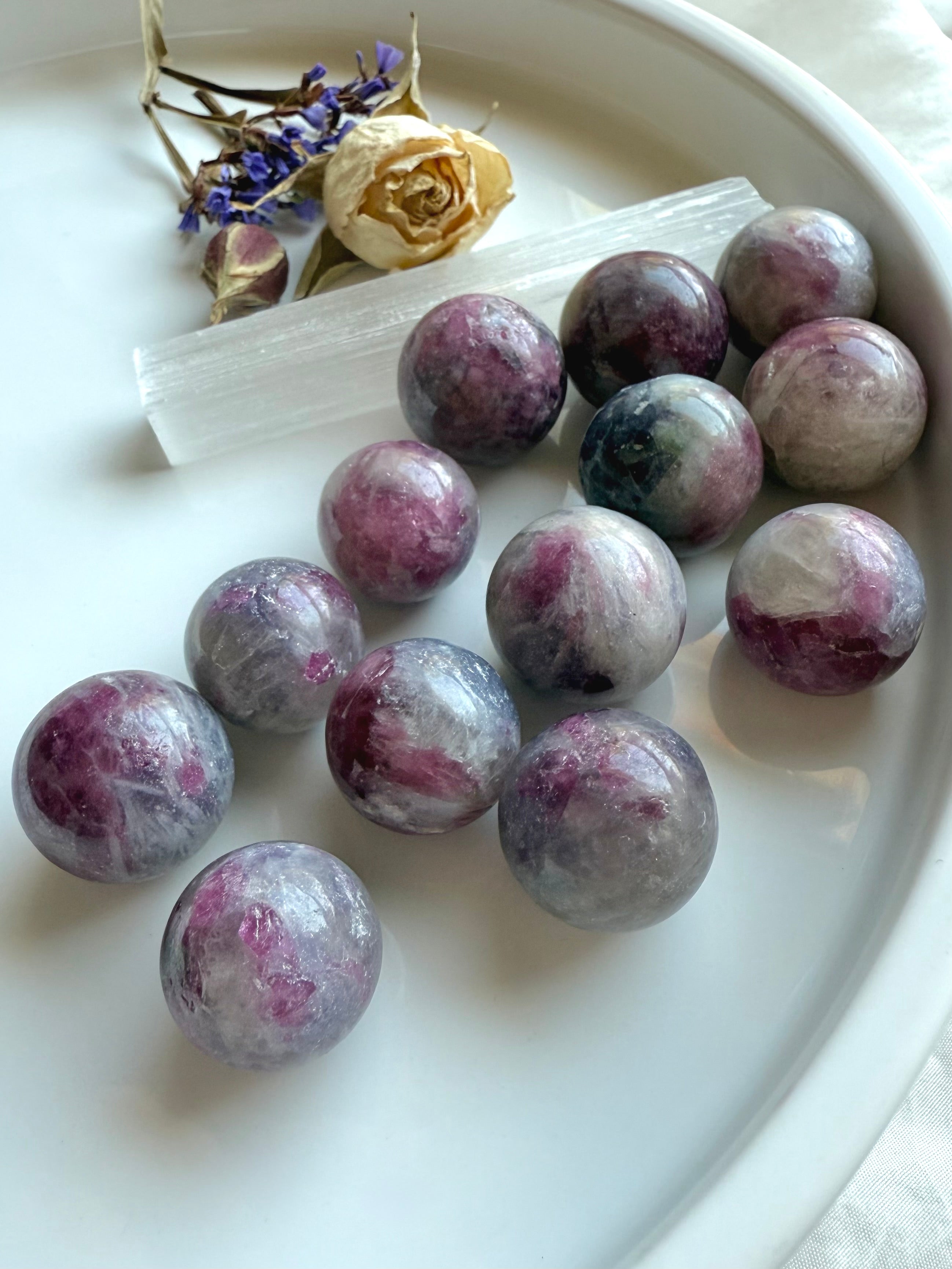 Cluster of Mini Unicorn Stone spheres with soft pastel colors for heart chakra healing energy