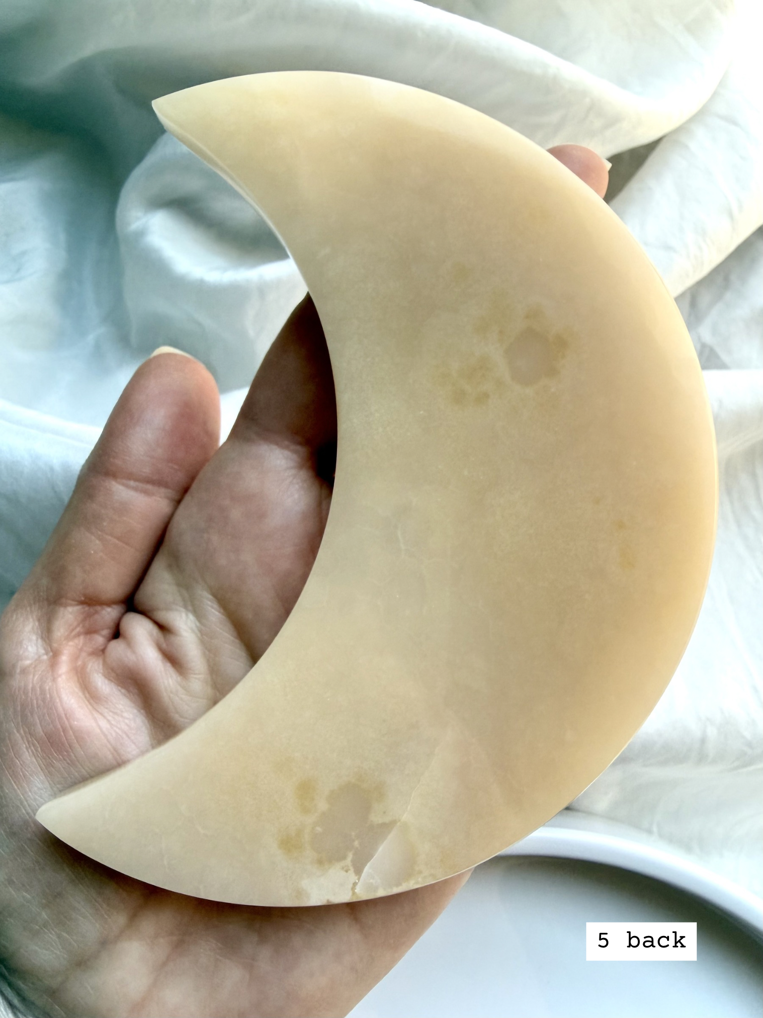 white onyx crescent moon plate # 5 back natural Mexican onyx crystal with soft beige tones and subtle banding