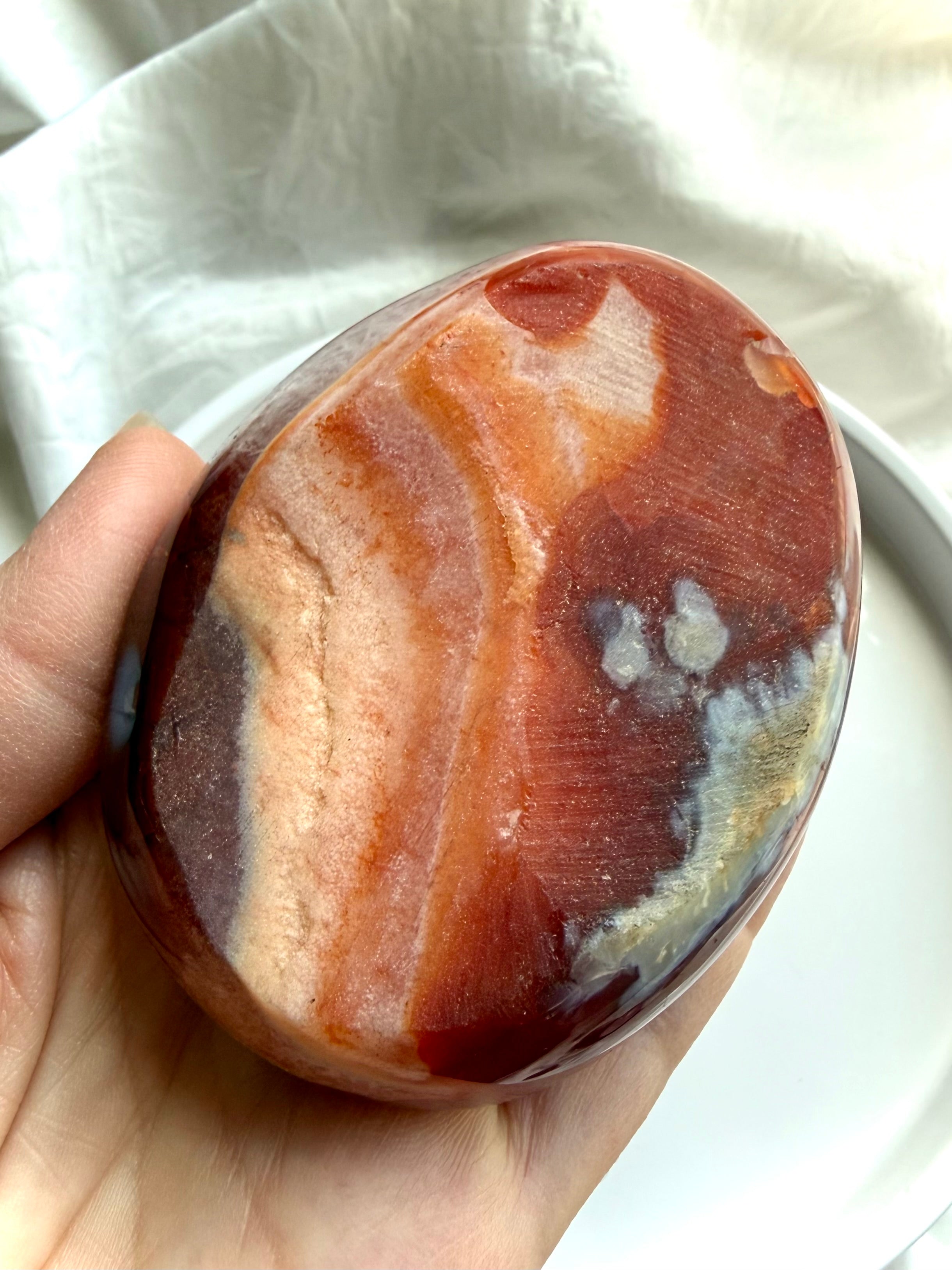 bottom view of carnelian and quartz crystal bowl with natural red and orange agate banding