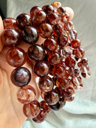 Fire Quartz bracelets with luminous Red Hematoid Quartz beads in deep red, smoky and translucent tones for grounding and vitality