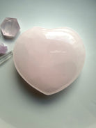 Polished Mangano Calcite heart meditation stone with smooth rounded shape and calming heart centered energy