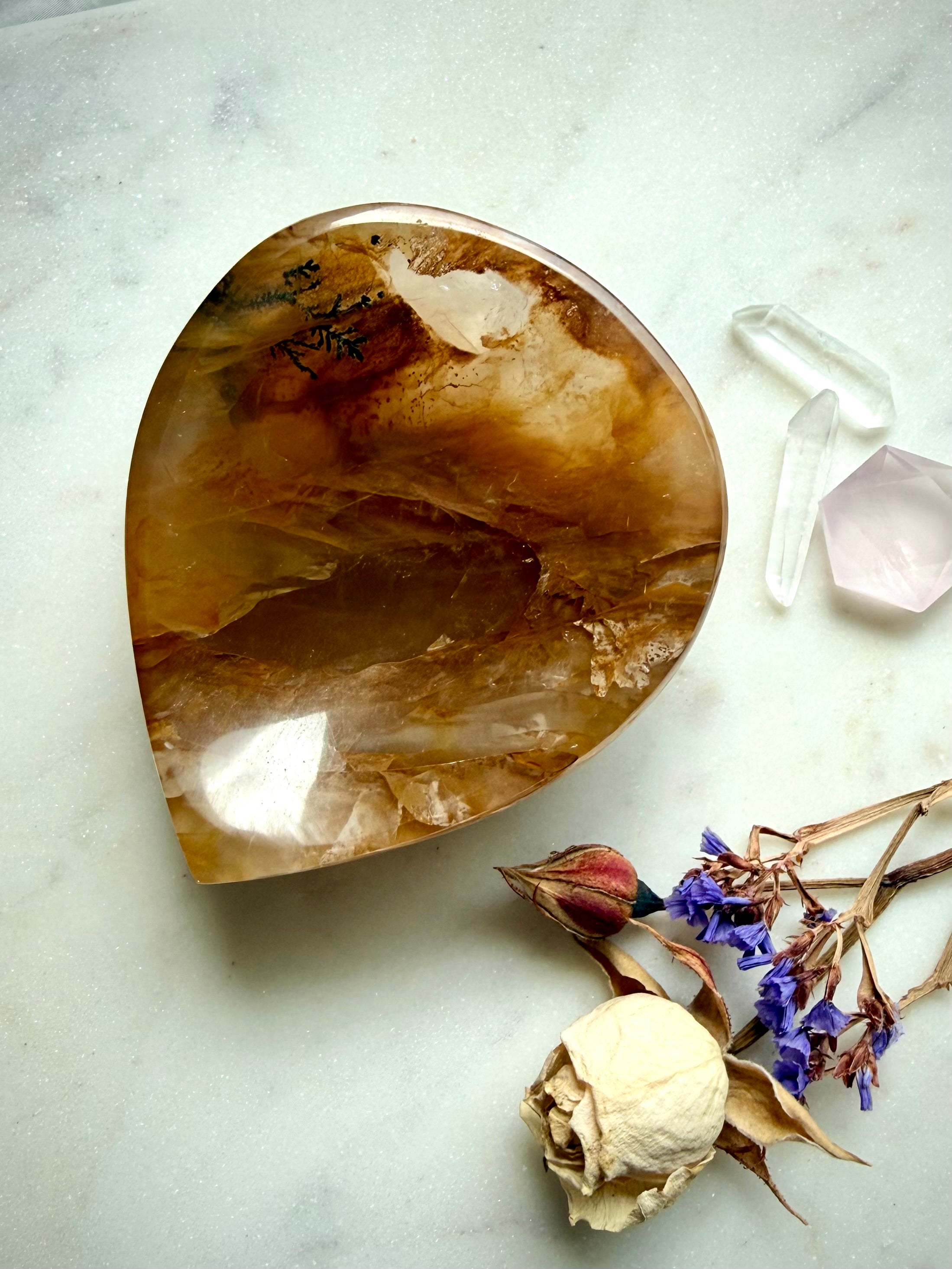 Golden Healer crystal bowl styled with jewelry on altar, natural quartz dish for spiritual decor
