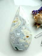 Orbicular Moss Agate flame showing quartz-rich patterns and soft translucence