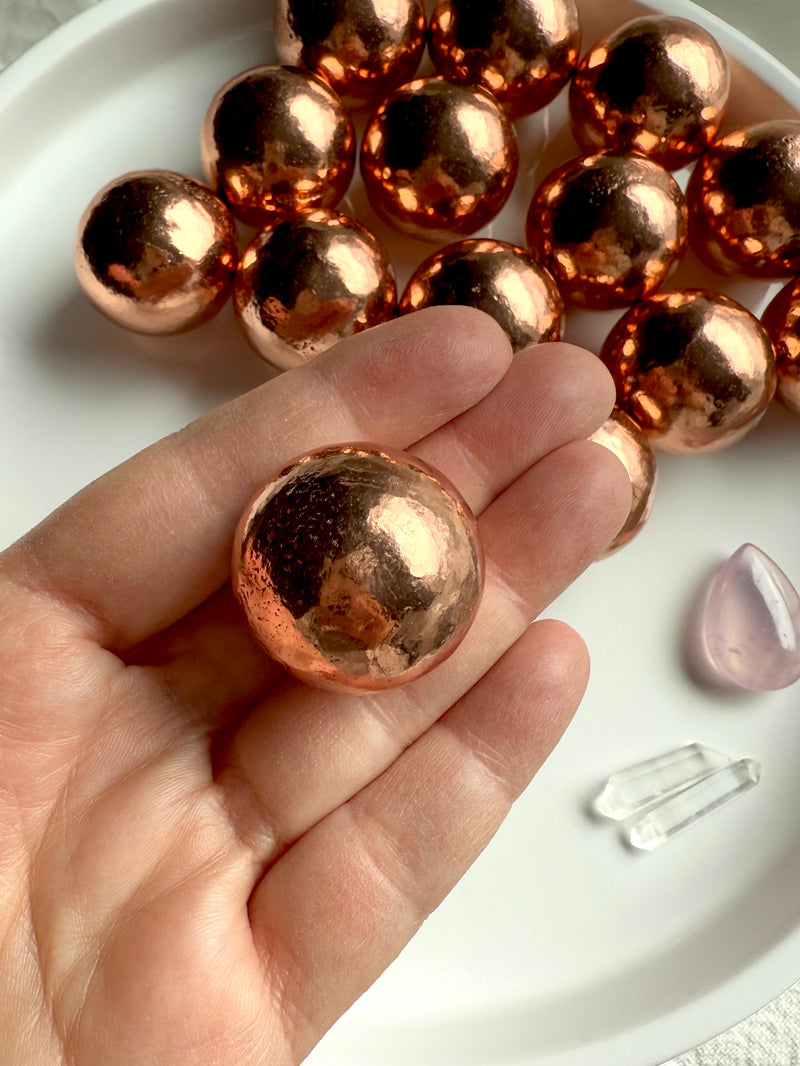 30 mm Michigan copper spheres shown on my hand for scale