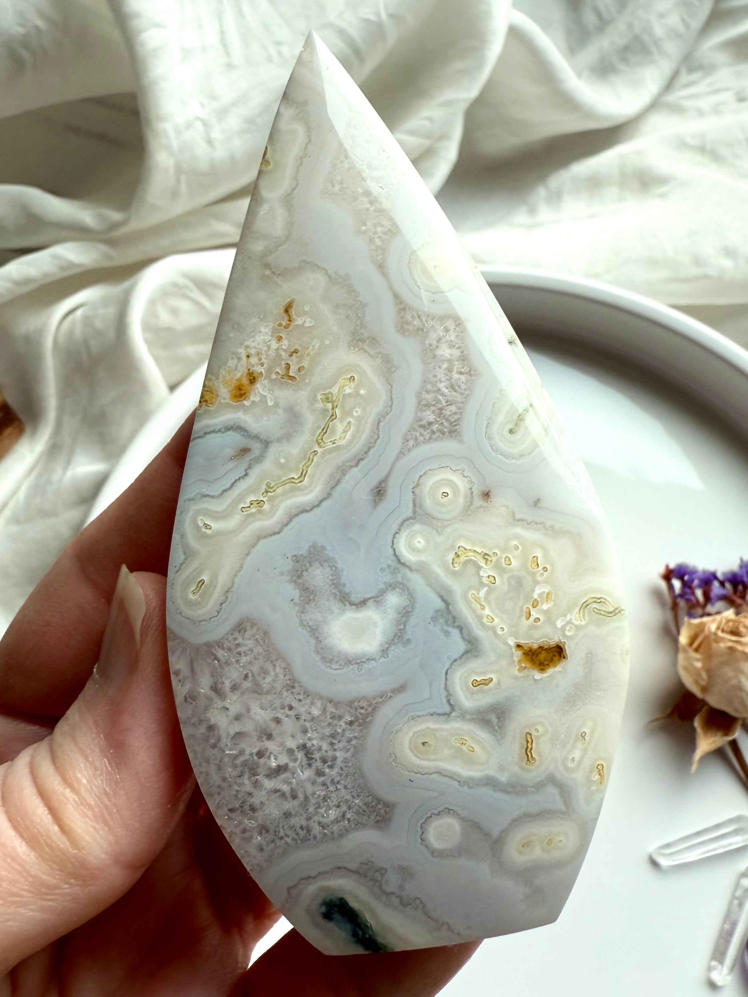 Quartz-rich Moss Agate flame with natural orbicular formations and soft glow