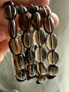 High-clarity Smoky Quartz bracelets – grounding crystal jewelry with polished flat oval beads
