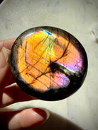 Rainbow Flash Labradorite crystal glowing with brilliant golden, green, blue and pink color for intuition and Third Eye Chakra energy