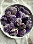 Dream amethyst palm stone with soft purple and white mineral patterns, calming amethyst crystal for peace and emotional balance