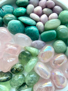 Close-up of Heart Chakra tumble stones — a vibrant healing crystal set featuring high-quality pink and green crystals for love and emotional healing.