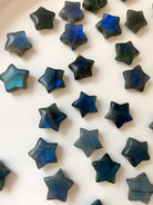 Labradorite mini crystal stars with deep blue flash, shown at an angle to highlight natural variations in color, shimmer & stone texture.