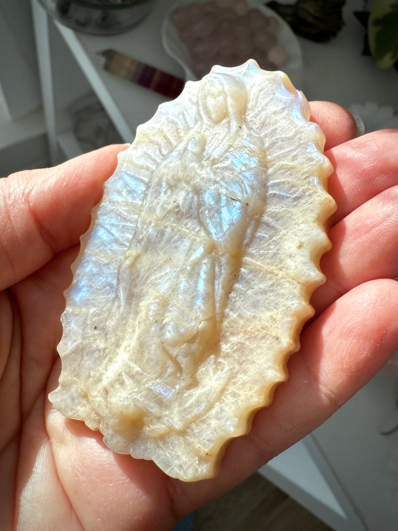 A Moonstone Mother Mary Figurine that fits nicely in the palm of your hand to hold in meditation