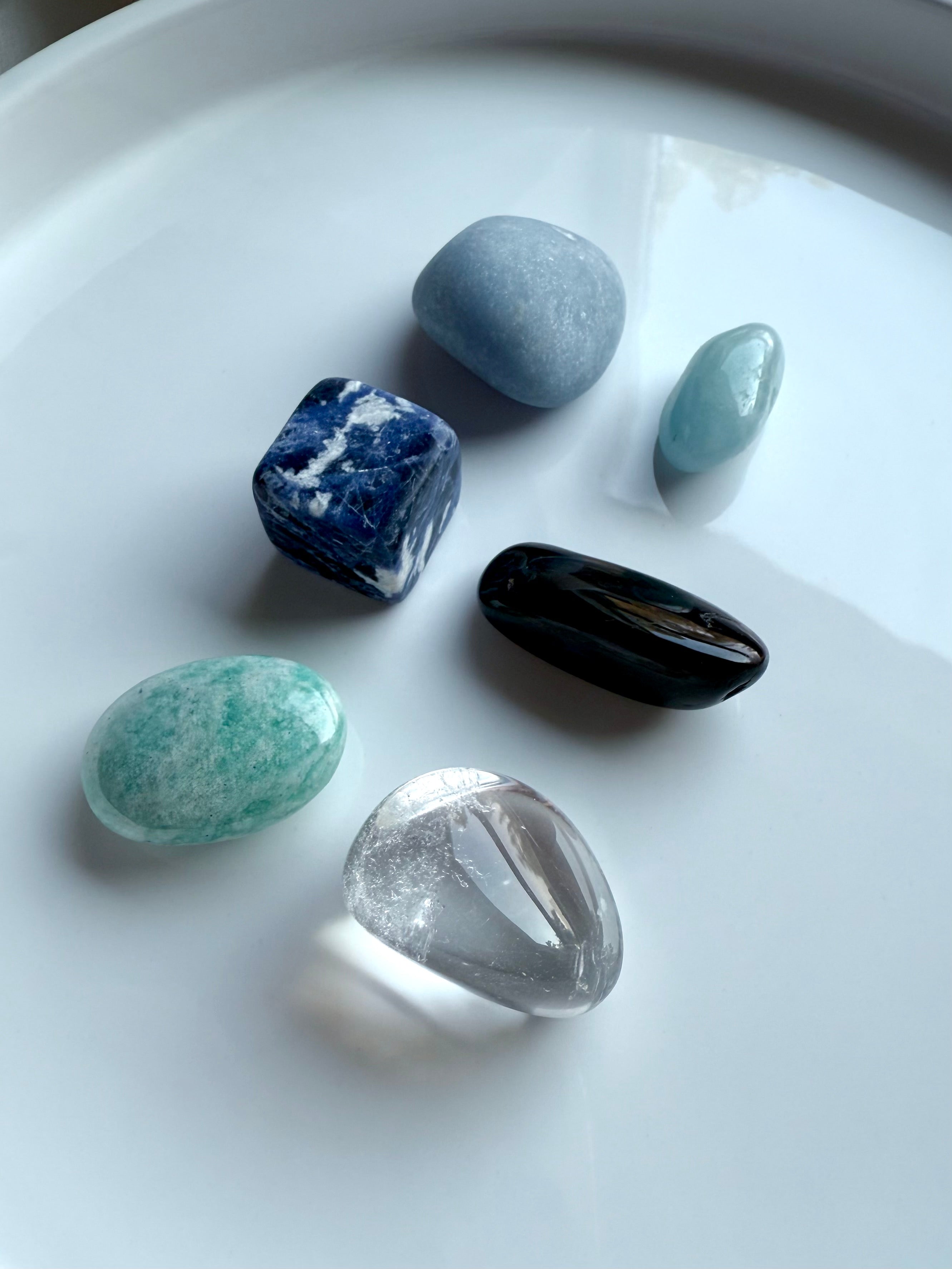 Group photo of Throat Chakra Crystal Set — Angelite, Sodalite, Amazonite, Aquamarine, Blue Tiger’s Eye, Clear Quartz
